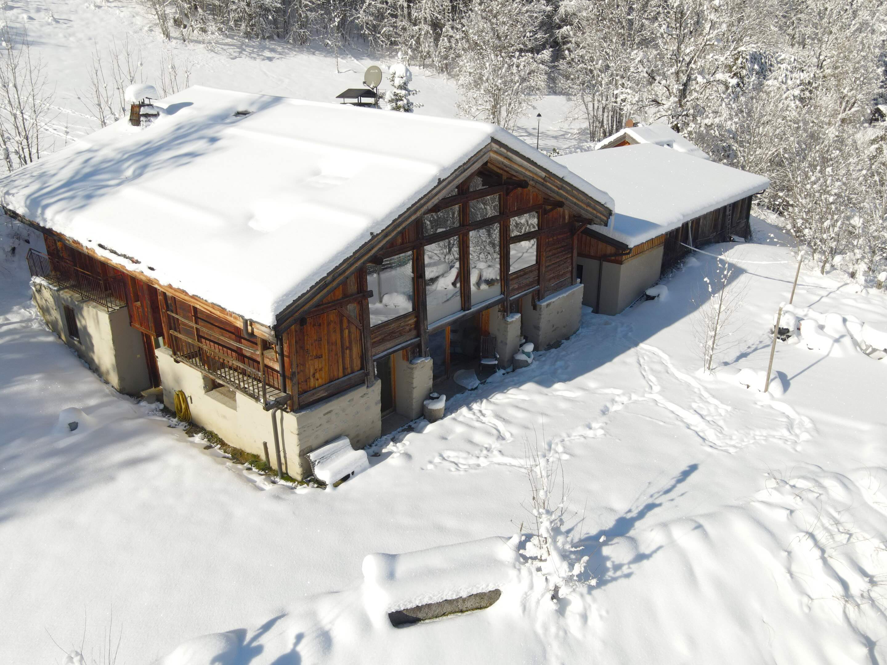 Drone photography service of house in a snow forrest