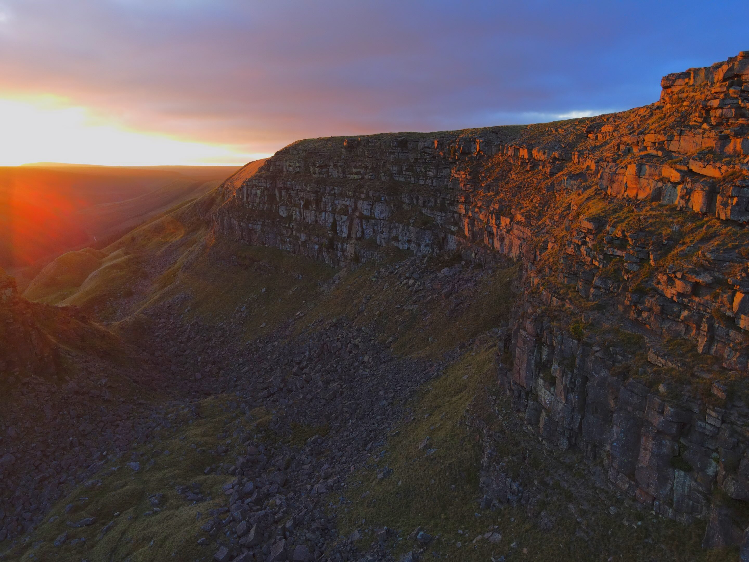 Drone photography service of sunset on a rock cliff